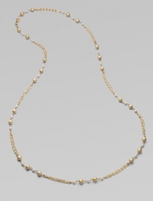 Strands of delicate golden chains gracefully connect textured golden beads and lustrous glass pearls in this elegant design that's long enough to double.Glass pearlsBrassLength, about 42Lobster claspImported