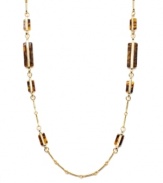 Neutral tones add a touch of warmth to your look. Lauren by Ralph Lauren necklace features trendy tortoise shell accents set in a delicate gold tone mixed metal chain. Approximate length: 36 inches.