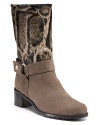 Animal-printed haircalf and soft leather add uptown style to a classic Western silhouette. By Stuart Weitzman.