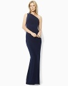 The sweeping glamour of a one-shoulder silhouette is captured in this elegant matte jersey dress, embellished with delicate ruching and a dazzling crystal-encrusted accent.