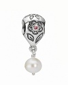 PANDORA's flower-engraved sterling silver charm features a punchy pink zirconia center and dangling white pearl accent.