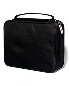 Back by popular demand - and now in sleek black nylon. This travel case is sized to fit your beauty must-haves from skincare to makeup and tools. Features a brush holder that can hold seven Short-Handle Brushes and two removable mesh pouches. (Cosmetics sold separately.)