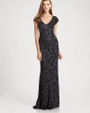 Allover beads and sequins create a dazzling effect on this festive, floor-length design.V necklineCap sleevesConcealed back zipFully linedAbout 61 from shoulder to hemNylonSpot cleanImportedModel shown is 5'11 (180cm) wearing US size 4. 