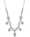 Eliot Danori's Windsor necklace catches eyes with teardrop, oval and marquise-shaped pendants embellished with sparkling glass crystal accents. Crafted in rhodium-plated silver tone mixed metal. Approximate length: 16 inches + 2-inch extender. Approximate drop: 3/4 inch.