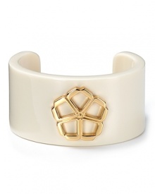 A graphic resin cuff provides a playful does of retro whimsy. Trina Turk's gold-tone floret emblem brings it up-to-the-moment modern.