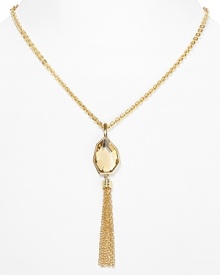 Eye-catching fringe gets a boost of elegance in this delicate pendant necklace from T Tahari. This statement piece features a faceted crystal stone, beautifully framed in gold-plated metal.