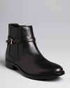 These IVANKA TRUMP Chelsea booties are a feminine version of the trend, with covered side panels and delicate ankle buckles.