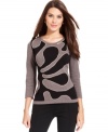 Alfani's sweater looks especially sleek with a graphic intarsia at the front and a flattering fit.