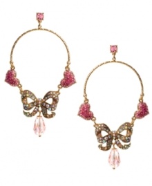 Make every day Valentine's Day! Betsey Johnson's sparkling gypsy hoops feature crystal-encrusted bows and pink crystal hearts. Crafted in gold tone mixed metal. Approximate drop: 3-1/3 inches. Approximate diameter: 1-9/10 inches.