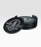 A striking set featuring a skull-and-crossbones motif, embossed in shimmering silver leaf and elegantly packaged in a sleek black leather case.Leather and silver leaf4½ diam.Imported