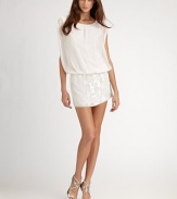 Flowing chiffon in a blouson fit with intricately beaded mini skirt.Crewneck Wide short sleeves Blouson bodice Beaded arm openings and skirt Keyhole nape with button closure About 19 from natural waist Polyester; spot clean Imported Additional Information Women's Premier Designer & Contemporary Size Guide 