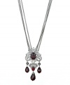 Spectacular style. T Tahari's Crystal Elegance Collection showcases majestic design, as exemplified by this faceted red crystal three strand necklace. Crafted in hematite tone mixed metal, it's enhanced by sparkling black crystal accents. Nickel free for sensitive skin. Approximate length: 32 inches + 4-inch extender. Approximate drop: 4 inches.