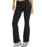 Nike's Legend bootcut athletic pants feature a wide waistband and a contoured fit to give you plenty of coverage any way you bend or stretch!