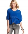 Sheer chiffon fabric and a flirty, tulip hem makes this dolman-sleeve top from Miss Chievous a total dream.