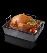 Meats, poultry and vegetables will cook to perfection in this heavy-duty pan. Like European roasters, it feature high sides to reduce splattering plus upright handles to facilitate lifting. The V-shaped rack elevates the main course for faster roasting and it helps keep crisp skins intact. Hard-anodized interior resists sticking and won't react to acidic ingredients, perfect for making rich pan gravies. 25 lb. capacity.