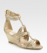 Fringe-like metallic leather straps, concluded with a self-covered wedge and an exposed back zipper. Self-covered wedge, 2½ (65mm)Metallic leather upperLeather lining and solePadded insoleImportedOUR FIT MODEL RECOMMENDS ordering true size. 