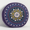 Inspired by the ornate brocade patterns of Morocco, this round decorative pillow adds an air of mystique to any decor.