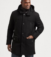 A dynamic outerwear selection to keep you stylishly warm all winter long, this piece exudes masculine cool, crafted in water- resistant wool with a removable hood, down-filled nylon bib and a sleek leather trim.Button-frontRemovable hoodChest welt, waist flap pocketsAbout 34 from shoulder to hemNylon bibDown fill60% wool/22% polyester/8% rayon/6% acrylic/4% nylonDry cleanImported