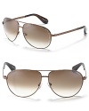 MARC BY MARC JACOBS classic and always in style aviator sunglasses with Marc Jacobs logo engraving on temple. Offered in brown with tortoise-inspired ear piece and brown gradient lens and black with dark burgundy ear piece and gray gradient lens.