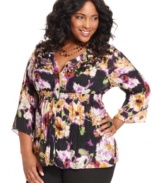 Flaunt feminine frills with NY Collection's three-quarter-sleeve plus size blouse, accented by a floral-print and ruffles.