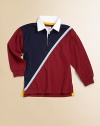 A classic rugby shirt is updated with sporty stripes in a colorblocked design for timeless style.Twill rugby collarLong sleevesButton-frontUneven side-vented hemCottonMachine washImported Please note: Number of buttons may vary depending on size ordered. 