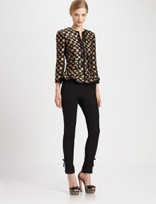 Featuring a peplum waist, one of the hottest trends of the season, this leopard-print jacquard jacket with metallic accents, is beyond eye-catching.Round collarLong sleevesSelf-tie detail at necklineFront zipperPrincess seamsPatch pocketsPeplum waistAbout 21 from shoulder to hem56% polyester/30% acetate/11% wool/3% polyamideDry cleanMade in Italy of imported fabric