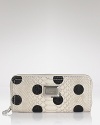 MARC BY MARC JACOBS' snake-embossed wallet makes a dotty statement. Get inspired by the spot-splashed runways and get this graphic grab as a practical take on the trend.