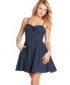 Sweetly alluring with its back cutout detail and a bustier-style bodice, this polka dot frock puts the a-line in adorable! From Jessica Simpson.