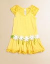 Bright and cheery with ruffles and daffodils, this perky frock will be your favorite and hers.ScoopneckShort ruffled sleevesDrop-waist with daffodilsPurl edge hem95% cotton/5% spandexMachine washImported