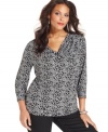 Liven up your neutral bottoms with Style&co.'s printed plus size top, finished by a draped neckline.