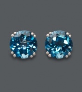 Dip into cool, blue hues. Round-cut London blue topaz (4-1/2 ct. t.w.) stud earrings are certain to make a splash! Crafted in 14k white gold. Approximate diameter: 8 mm.