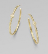 From the Jolie Collection. Elegantly fluted gold hoops, accented with gold beading and quatrefoil shapes set with sparkling diamonds.Diamonds, .12 tcw14k yellow goldDiameter, about 1½Post backImported