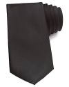 A handsome solid tie in soft silk offsets your dress shirting with a satiny hue for a classic statement.