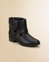 Foldover-cuff leather boots tough enough to withstand the worst in cycle-chic style.Foldover cuff snaps in backBuckled ankle strapsPebbled leather upperFabric liningMolded lug soleSturdy stacked heelImportedAdditional InformationKid's Shoe Size Guide (European Equivalent) 