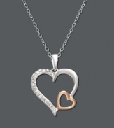 Double up on the love. Necklace features two open-cut hearts - one in sterling silver and an overlapping heart in 18k rose gold over sterling silver. Surface features a light dusting of round-cut diamond accents. Approximate length: 18 inches. Approximate drop: 1 inch.