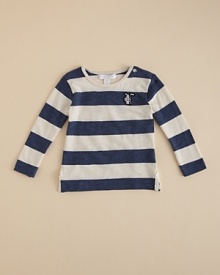 A longsleeve tee is rendered in wide rugby stripes and accented with buttons at the left shoulder.