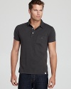 A classic polo design is updated with a trim, modern fit that's suitable for a variety of casual venues.