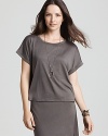 Feminine and flowing, this Eileen Fisher boxy top is cut in a relaxed silhouette and finished with rolled short sleeves.