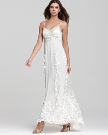 An opulently beaded bodice and sweeping skirt of three-dimensional petals lend evening opulence to this Sue Wong gown.