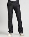 Saturated, dark-wash denim is designed with a slim fit through the waist and relaxed, straight legs. Five-pocket style Zip fly Inseam, 33/34 Cotton/elastene; machine wash Imported