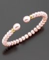 The perfect romantic accent to your lovely look; this bracelet features beautiful pink cultured freshwater pearls (6-9 mm) set in 14k gold. Approximate diameter: 2 inches. Approximate length: 7 inches.