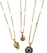 Mystical and mysterious, RACHEL Rachel Roy's trio necklace conveys edgy glamour with skull, snake and evil eye pendants. Made in gold tone mixed metal with glass crystal accents. Approximate length: 18 inches + 2-inch extender. Approximate drop: 1/2 inch to 1 inch.