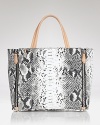 The classic canvas bag is re-rendered for the cool girl in an on-trend python print. Make a serpentine statement with this tote from Sam Edelman.