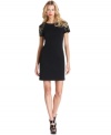 Shiny grommets at the shoulders give this MICHAEL Michael Kors dress glamorous edge.