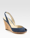 Comfort-minded denim wedge with a stretchy slingback and low-cut upper. Cork wedge, 4 (100mm)Cork platform, 1 (25mm)Compares to a 3 heel (75mm)Denim upperLeather lining and solePadded insoleImported