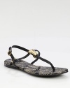 Adjustable leather straps with a goldtone T adornment, grounded by a snake-print leather footbed. Leather and snake-print leather upperLeather liningRubber solePadded insoleImported