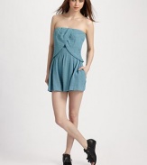 A contemporary take on the romper silhouette, finished a chic crossover overlay and flared shorts.Strapless Overlay with tulip hem Elastic waistband Concealed size zipper Inseam, about 3 79% viscose/21% nylon Dry clean Imported