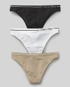 Calvin Klein Underwear seamless thong. A comfortable seamless thong with logo and stripe detail on waistband. Cotton gusset.