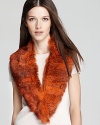 The ultimate in Burberry luxury, this fur stole features asymmetrical edges and a burnt orange hue.