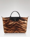 In a wild tiger print, Longchamp's cotton handbag channels safari-chic.